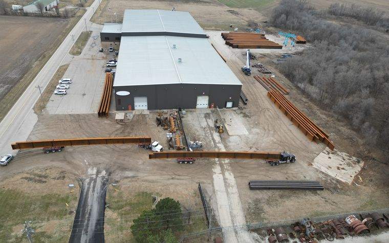 Aerial view of the Regal Industrial Pekin Illinois coating facility with bridge girders staged outside