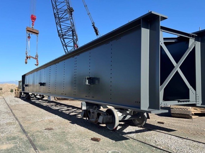 Coated plate girder staged on a rail car at the project site, Regal Industrial